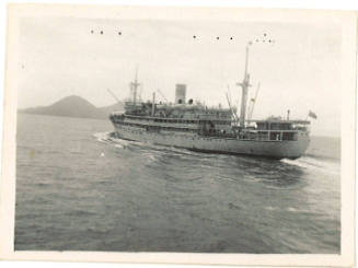 Photograph depicting a vessel sailing near islands