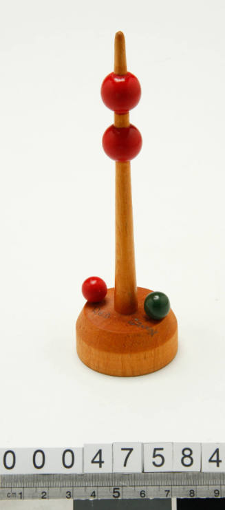 Wooden buoy with two red balls