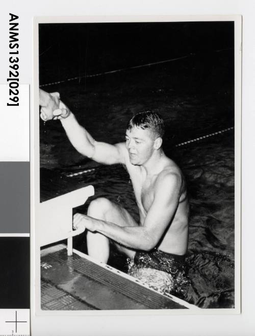 Terry Gathercole climbing out of a pool