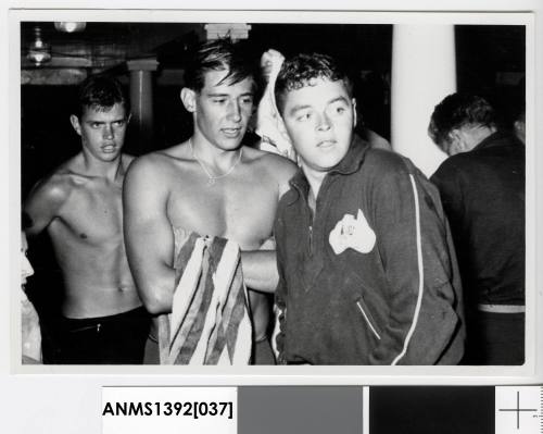 Terry Gathercole with two unidentified male swimmers