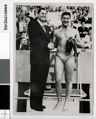 French swimming champion Alex Jany being congratulated by American swimming champion Johnny Weissmuller