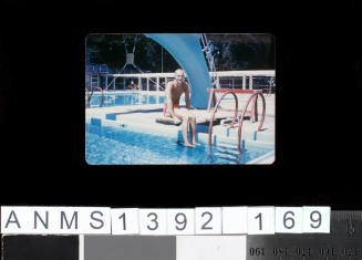 Donald Pansch sitting at a swimming pool possibly in Brazil