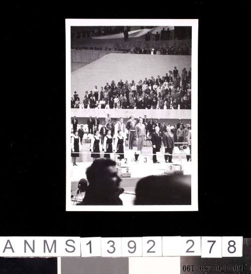 United States swimmer Don Schollander receiving a gold medal at the 1964 Tokyo Olympic Games