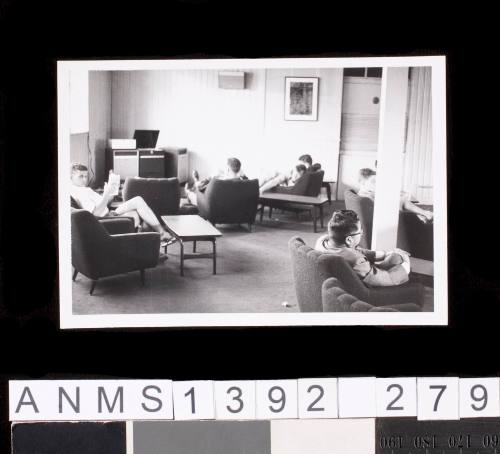 Men in a sitting room at the Tokyo Olympic Games village