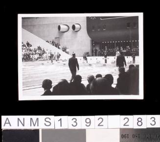 Spectators watching an event at the 1964 Tokyo Olympic Games pool