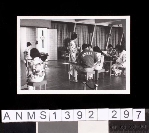 People in a sitting area at the 1964 Tokyo Olympic Games Village