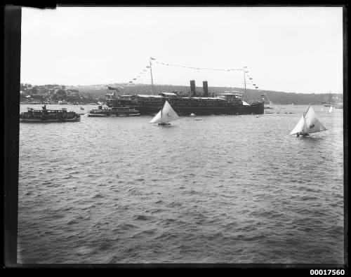 Passenger liner acting as a flagship for a regatta on Sydney Harbour