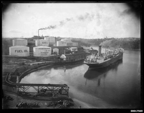 Shell Oil terminal, possibly Gore Bay Terminal in Sydney, with a ship moored beside it