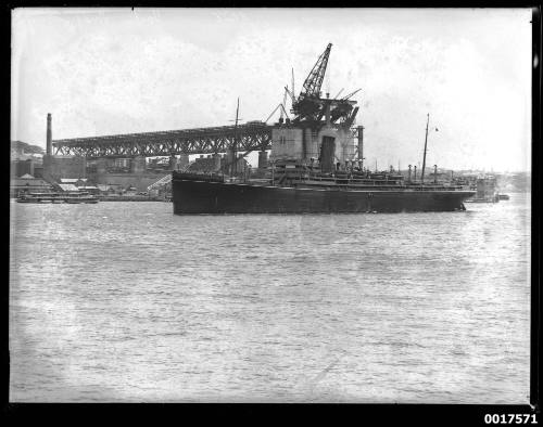 SS MONGOLIA underway with the Sydney Harbour Bridge construction in background