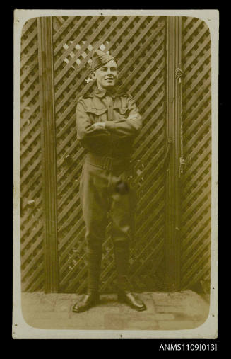 Photographic postcard of a man dressed in military clothing