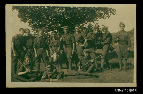 Young soldiers with a goat