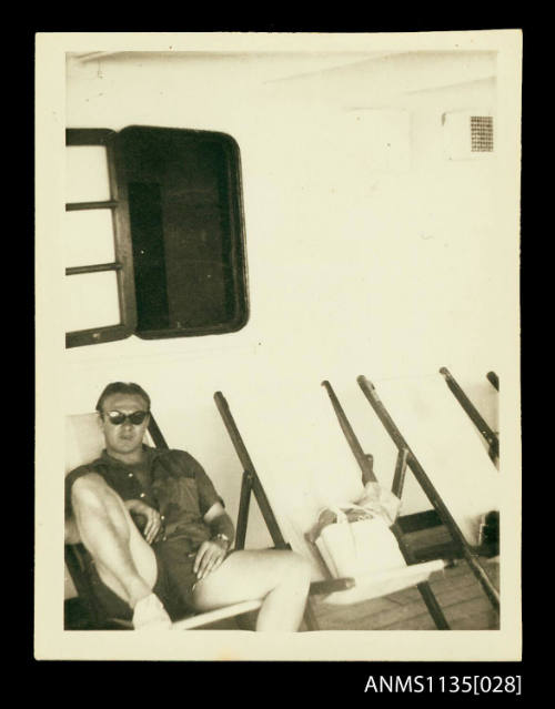 Man lounging on a deck chair on board the STRATHMORE