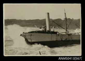 Photograph of depicting a wrecked cargo ship