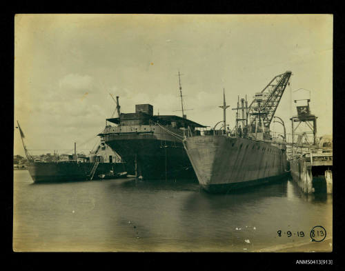 Stern views of  ADELAIDE, BRISBANE and unidentified vessel