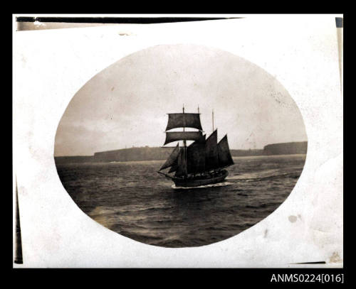 Photograph at centre is three masted topsail schooner, bow and port view