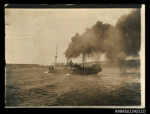 Photograph centre stern and port view of steam ship central funnel, smoke pouring skywards