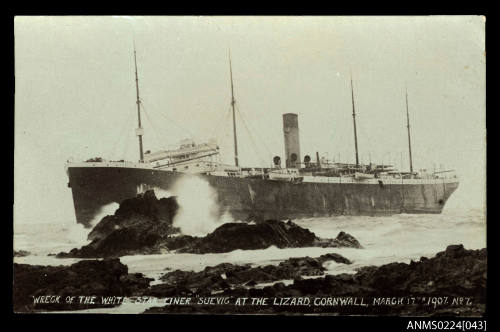 Close up port view of large cargo passenger ship aground