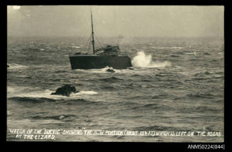 Bow of ship, port view, wrecked on rocks at shore