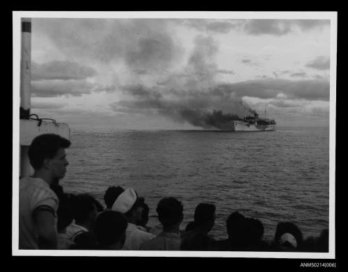 Passengers watching MV SKAUBRYN on fire in the Indian Ocean