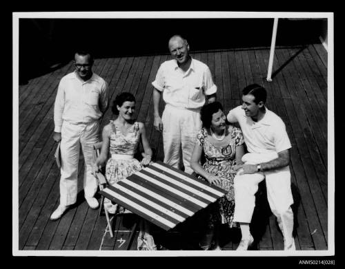 Five passengers on deck of ship