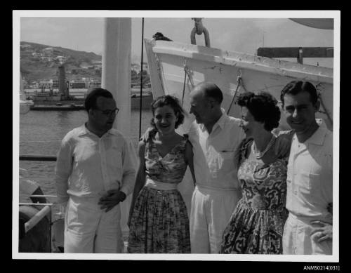 Five passengers on deck of ship