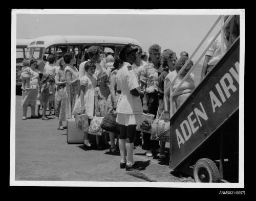 Passengers rescued from the sinking of the MV SKAUBRYN in the Red Sea, at Aden airport boarding a plane to take them to Australia