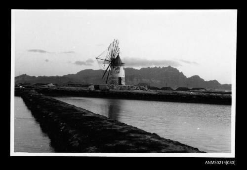 Rural scene with retaining walls and windmill