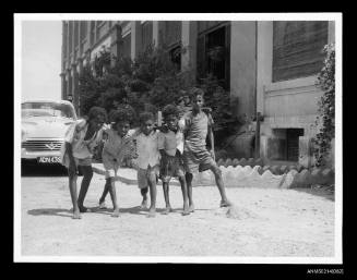 Five boys pose for the camera in Aden