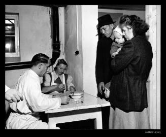German family about to receive medical check at Lesum, Germany, prior to migration to Australia