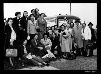 Group of young women waiting near bus