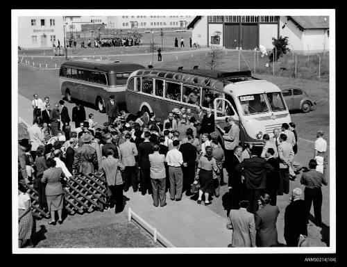 People gathered around buses at camp Lesum, Bremen