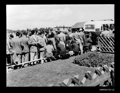 Greek migrants boarding buses to take them from Camp Lesum, Bremen to Bremerhaven port for embarkation