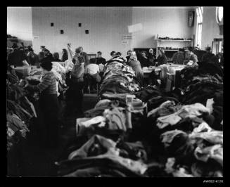 People examining clothes in store