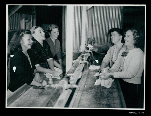 Women washing laundry at a migrant reception centre