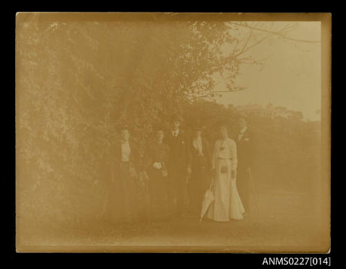 Six adults in garden scene