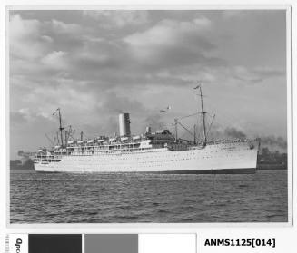 P&O passenger liner STRATHEDEN arriving in Sydney Harbour. A large crane at Garden Island can be seen just astern of the liner.