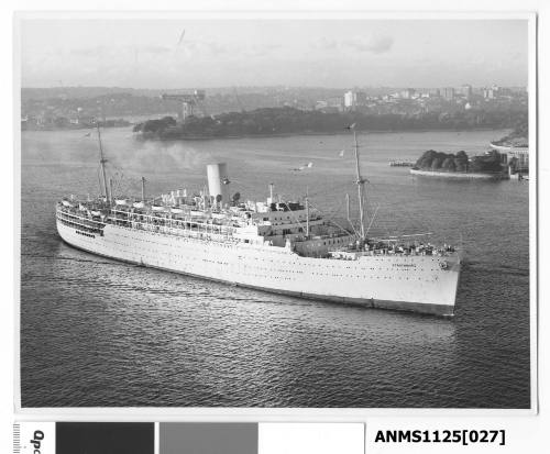 P&O liner STRATHMORE arriving in Sydney Harbour  with the Titan, a large floating crane, visible near Mrs. Macquarie’s Point.