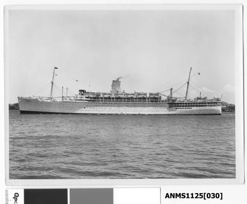 The P&O passenger liner STRATHMORE outward bound and passing Sydney Cove with the wireless mast on top of the AWA building in York street visible.