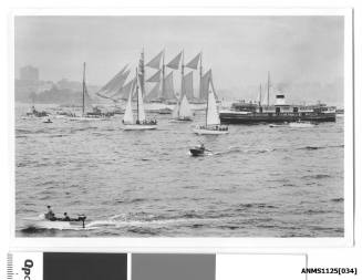 ESMERALDA, a four- masted barquentine of the Chilean Navy arriving in Sydney and being escorted by many small craft including the Sydney Ferry BARACOOLA.