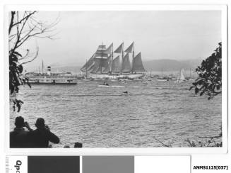 ESMERALDA, a four-masted barquentine training ship of the Chilean Navy, arriving in Sydney Harbour escorted by many small craft including the ferry the SYDNEY QUEEN.