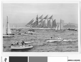 ESMERALDA, a four-masted barquentine training ship of the Chilean Navy, arriving in Sydney Harbour escorted by many small craft.