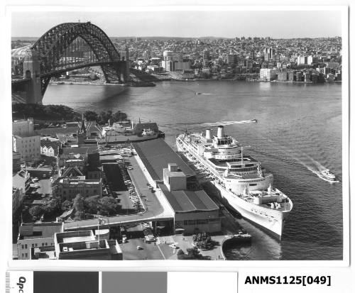 ORIANA, a twin funnel P&O passenger liner, moored  at the International Terminal Circular Quay. Early buildings such as the Sydney Sailors Home are also in view.