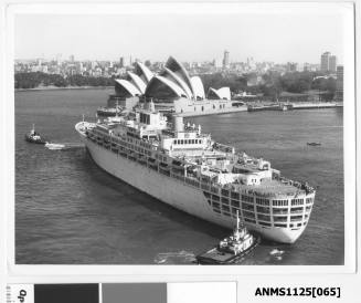 P&O passenger liner ORIANA outward bound from Sydney Harbour and being assisted by two tugboats