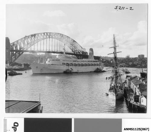 P&O liner CANBERRA arriving at Circular Quay with three tugboats assisting