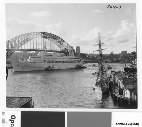 P&O liner CANBERRA arriving at Circular Quay with three tugboats assisting