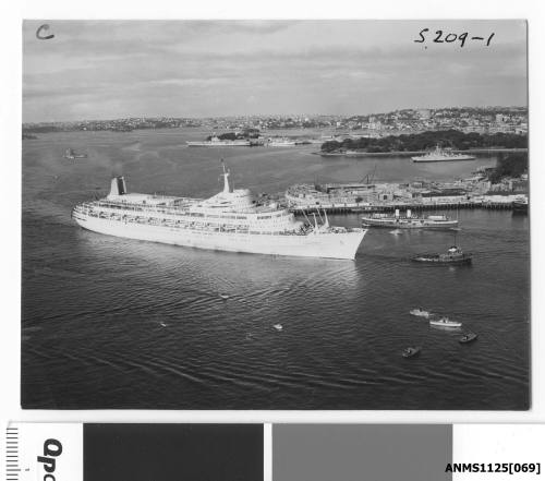 P&O liner CANBERRA entering Sydney Harbour assisted by a tugboat, with the Sydney Opera House in the background