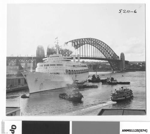 P&O liner CANBERRA berthing at Circular Quay assisted by four tugboats and a motor launch including the WOOREE.