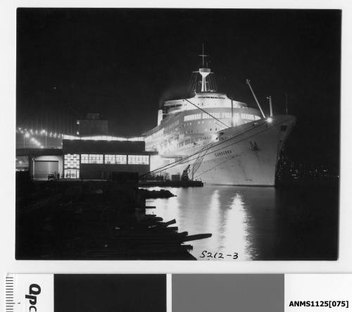 Twin funnel P&O liner CANBERRA moored starboard side to wharf at Circular Quay, Sydney Harbour