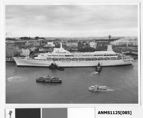 P&O passenger liner CANBERRA being pushed by two tugboats on her port side into her berth at Circular Quay